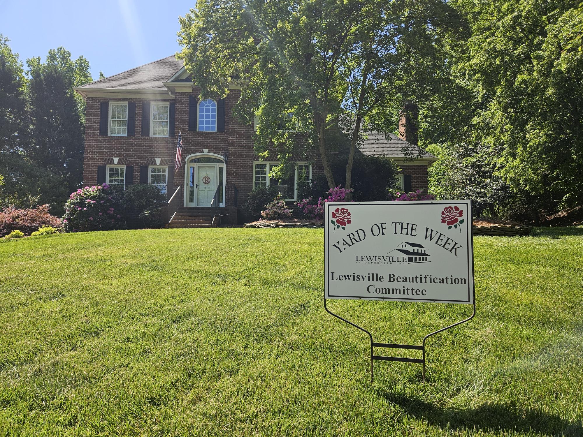 Yard of the Week sign by the Lewisville Beautification Committee